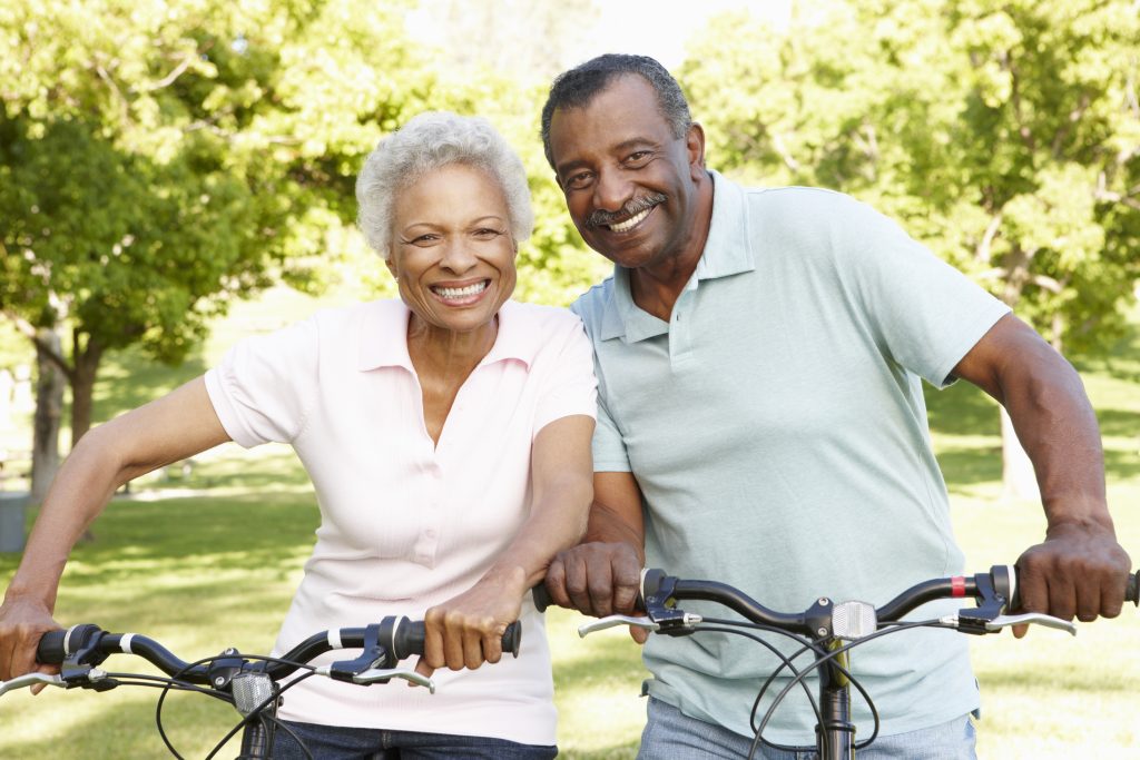 Senior,African,American,Couple,Cycling,In,Park